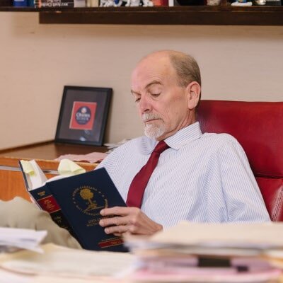 A medical malpractice attorney reading a law book in Columbia, SC